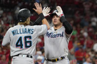 Miami Marlins' Avisail Garcia, right, is congratulated by teammate Luke Williams after hitting a two-run home run during the ninth inning of a baseball game against the St. Louis Cardinals Wednesday, June 29, 2022, in St. Louis. (AP Photo/Jeff Roberson)