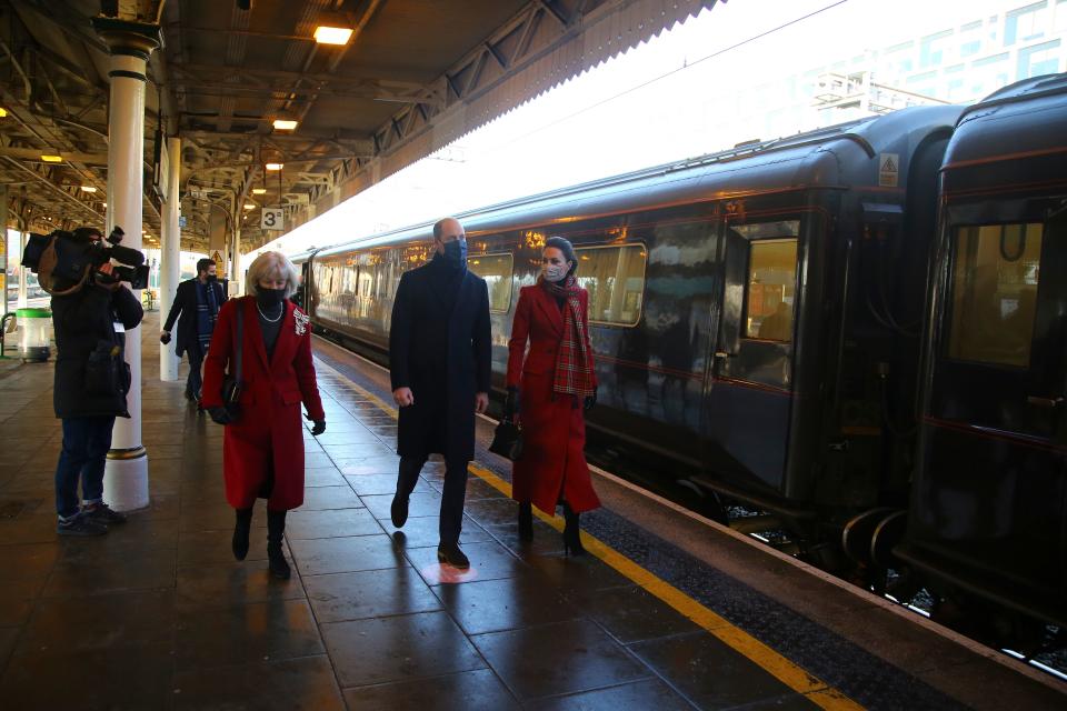 Britain's Prince William (C), Duke of Cambridge and Britain's Catherine (R), Duchess of Cambridge walk with Lord Lieutenant of South Glamorgan Morfudd Meredith (L) as they arrive at Cardiff Central train station in Cardiff, South Wales on December 8, 2020, on the final day of engagements on their tour of the UK. - During their trip, their Royal Highnesses hope to pay tribute to individuals, organisations and initiatives across the country that have gone above and beyond to support their local communities this year. (Photo by Geoff Caddick / various sources / AFP) (Photo by GEOFF CADDICK/AFP via Getty Images)