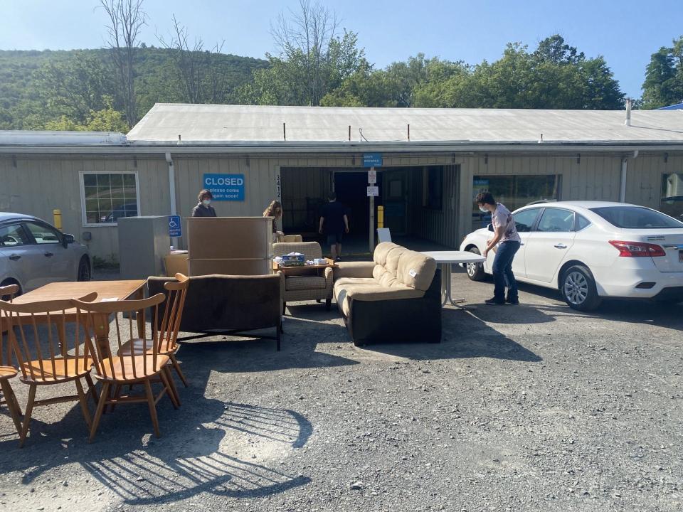 Corning Community College students helped Habitat for Humanity Wednesday salvage what is left of the ReStore, which was badly damaged by a July fire.