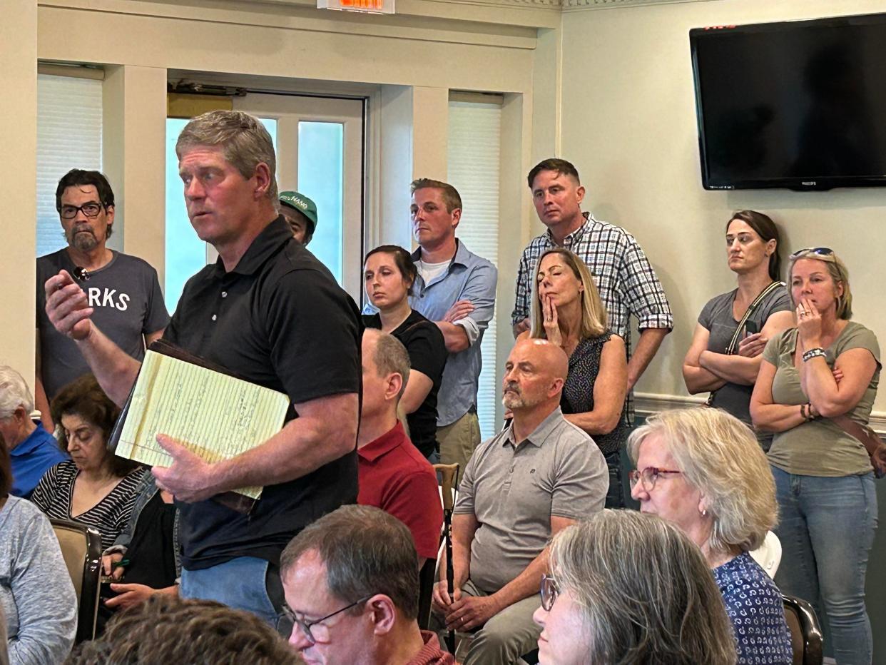 Steve Hadden, who farms land surrounded by homes on Columbus' Far North Side, speaks at a meeting Wednesday to defend his use of biosolids to fertilize.