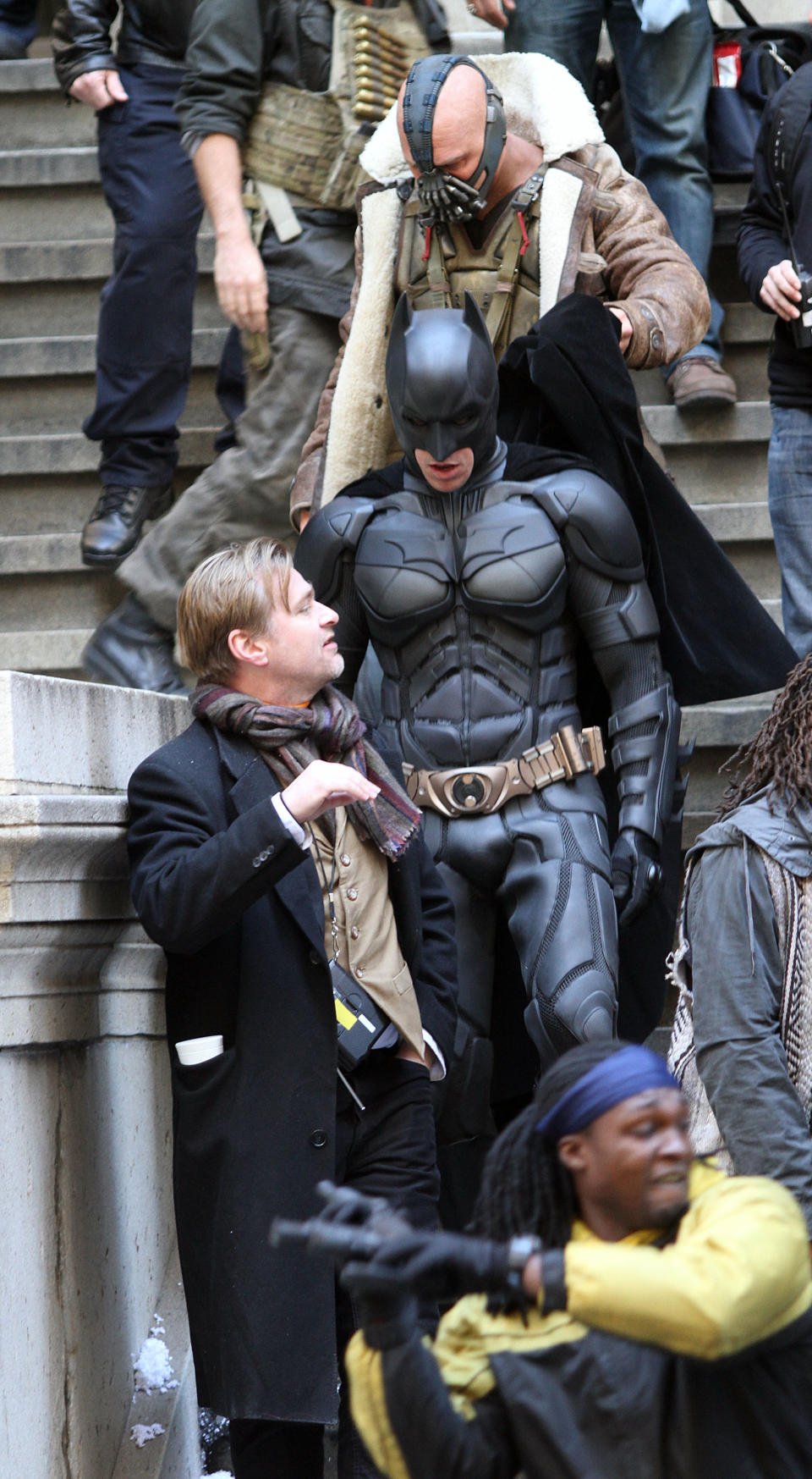 NEW YORK, NY - NOVEMBER 05:  Actors Christian Bale in costume as Batman, Tom Hardy as Bane  and director Christopher Nolan are seen on the set of "The Dark Knight Rises" on location on Wall Street on November 5, 2011 in New York City.  (Photo by Marcel Thomas/FilmMagic)