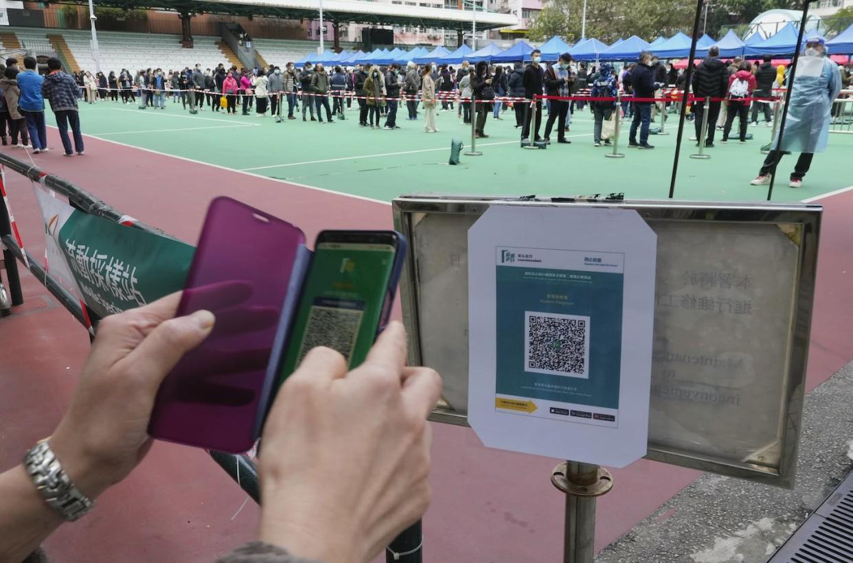 QR codes are visual patterns that store data smartphones can read. <a href="https://newsroom.ap.org/detail/VirusOutbreakHongKong/dd01c7a3521b4ab59ba48ee2bc24d09c/photo" rel="nofollow noopener" target="_blank" data-ylk="slk:AP Photo/Vincent Yu;elm:context_link;itc:0;sec:content-canvas" class="link ">AP Photo/Vincent Yu</a>