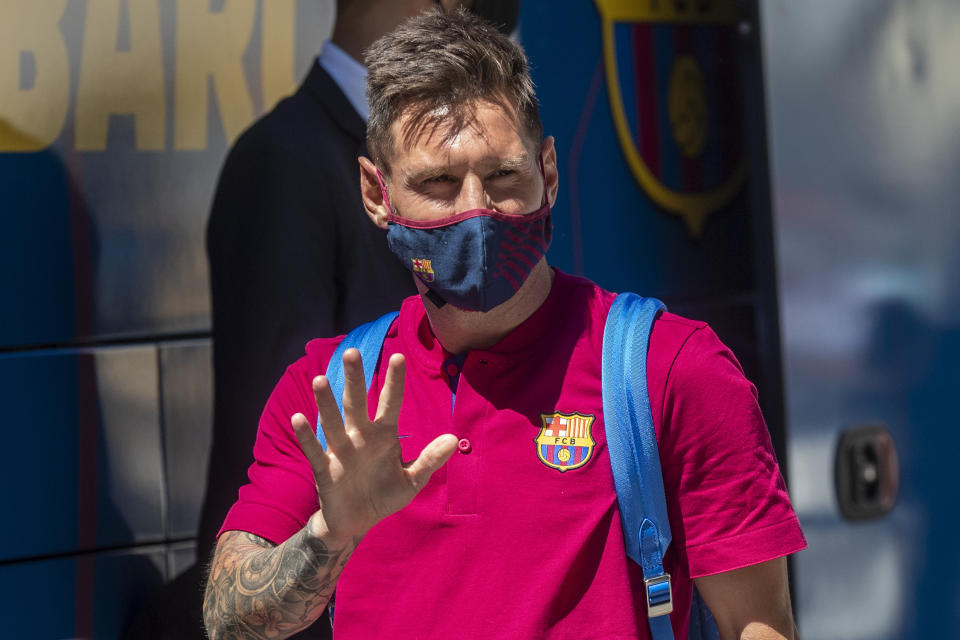 FILE - In this Aug. 13, 2020 file photo, Barcelona's Lionel Messi waves as he arrives at the team hotel in Lisbon, Portugal. Lionel Messi has told Barcelona he wants to leave the club after nearly two decades with the Spanish giants. The club has confirmed that the Argentina great has sent a note expressing his desire to leave. The announcement comes 11 days after Barcelona's humiliating 8-2 loss to Bayern Munich in the Champions League quarterfinals, one of the worst in the player's career and in the club's history.(AP Photo/Manu Fernandez, File)