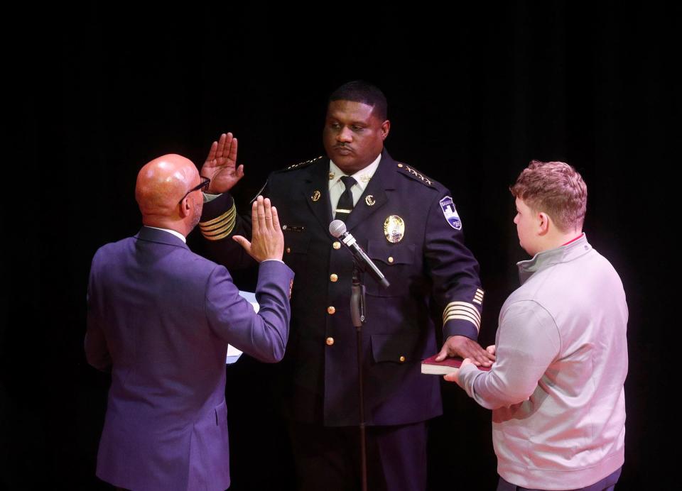 Clerk of Council Mark Massey administers the oath of office to Savannah Police Chief Lenny Gunther during a special ceremony on Tuesday January 10, 2023 at the Savannah Cultural Arts Center.