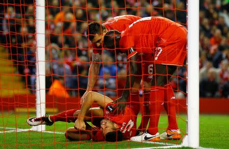 Football Soccer - Liverpool v Borussia Dortmund - UEFA Europa League Quarter Final Second Leg - Anfield, Liverpool, England - 14/4/16 Liverpool's Emre Can lies on the goal line after sustaining an injury Reuters / Darren Staples Livepic EDITORIAL USE ONLY. - RTX2A0M8
