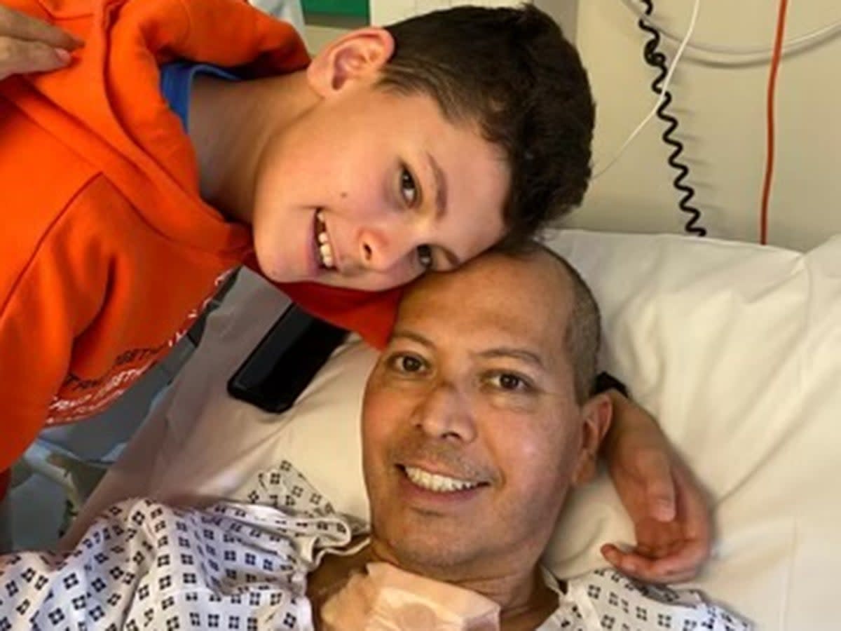 Cesar Franco, 50, with son Gabriel after the surgery  (PA)