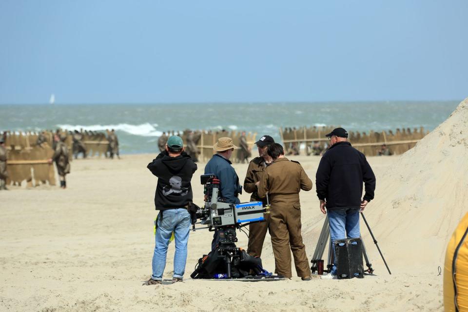 A camera crew on the beach on the set of Christopher Nolan's 'Dunkirk', 2016