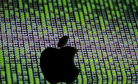 FILE PHOTO: A 3D printed Apple logo is seen in front of a displayed cyber code in this illustration taken March 22, 2016. REUTERS/Dado Ruvic/Illustration/File Photo