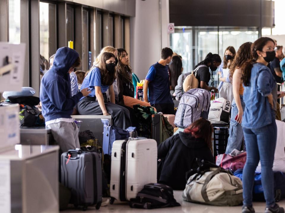 Travelers wait at Newark Liberty International Airport.