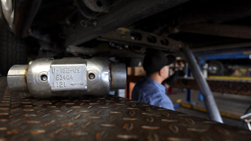 A photo of a new catalytic converter about to be fitted to a car. 