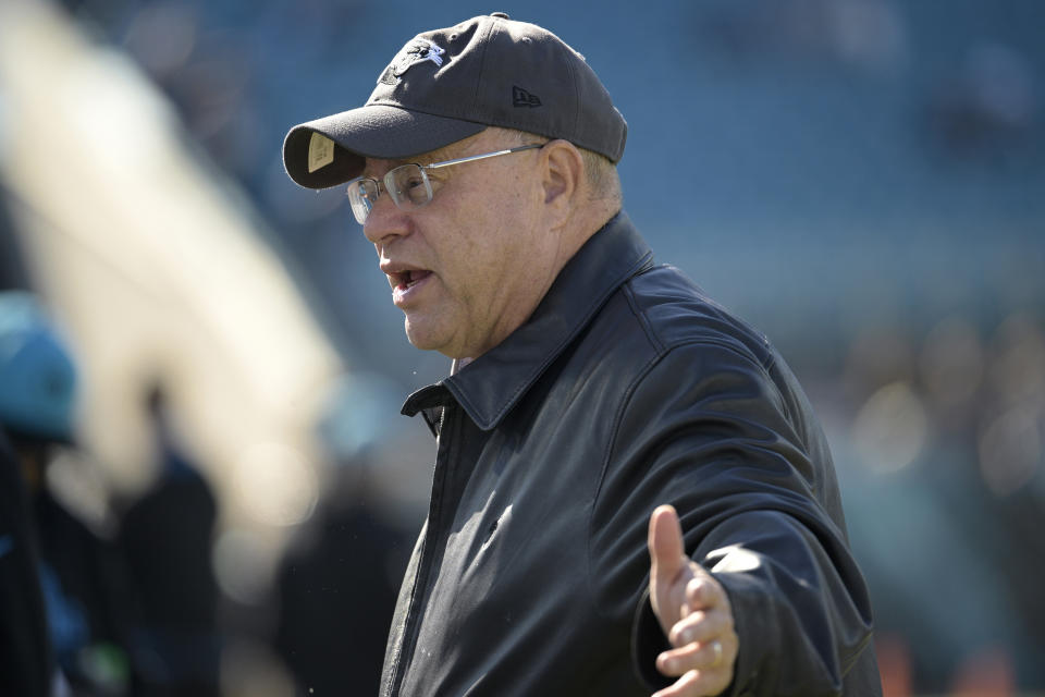 Carolina Panthers owner David Tepper watches players warm up from the sideline before an NFL football game against the Jacksonville Jaguars, Sunday, Dec. 31, 2023, in Jacksonville, Fla. Tepper now finds himself embroiled in a public relations nightmare after a video surfaced of the billionaire allegedly throwing the contents of a drink at a fan following a 26-0 loss to the Jaguars on Sunday. (AP Photo/Phelan M. Ebenhack, File)