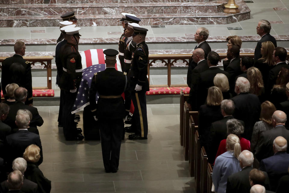 The flag-draped casket of former President George H.W. Bush is carried by a joint services military honor guard during a funeral for former President George H.W. Bush at St. Martin’s Episcopal Church Thursday, Dec. 6, 2018, in Houston. (Photo: Mark Humphrey/AP)