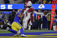 Los Angeles Rams inside linebacker Troy Reeder, left, pressures Arizona Cardinals quarterback Kyler Murray (1) into throwing a pass that was intercepted and returned for a touchdown by David Long Jr. during the first half of an NFL wild-card playoff football game in Inglewood, Calif., Monday, Jan. 17, 2022. (AP Photo/Mark J. Terrill)