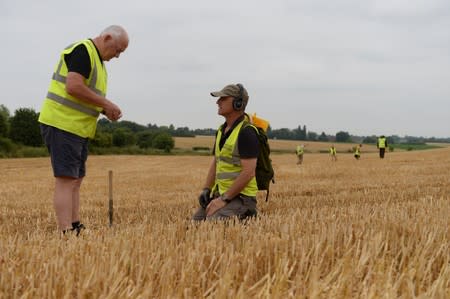 Army veterans and archeologists dig as part of archaeological research campaign called "Waterloo Uncovered" in Waterloo