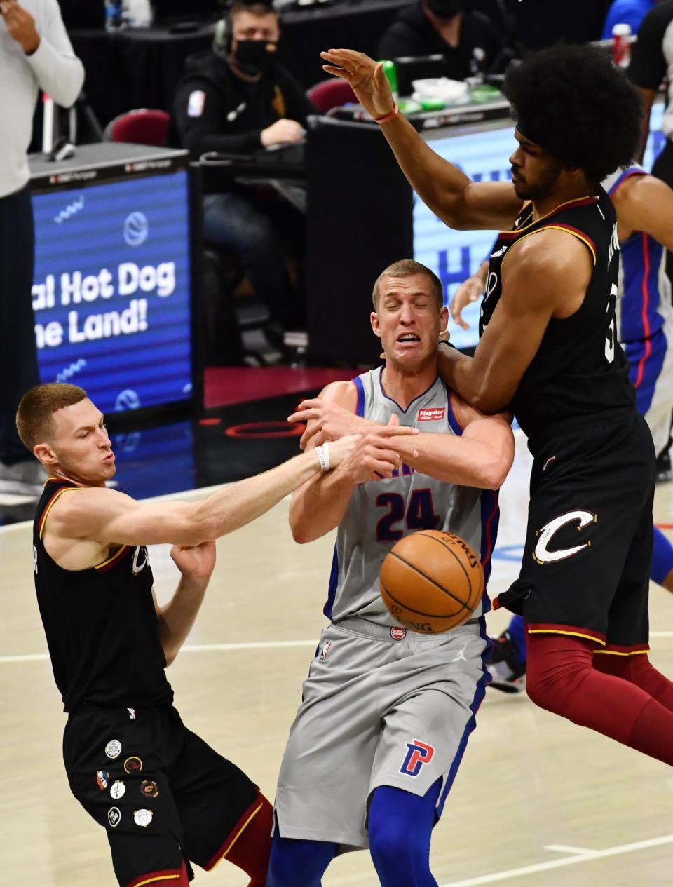 Cleveland Cavaliers guard Dylan Windler (9) fouls Detroit Pistons center Mason Plumlee (24) as Cavaliers center Jarrett Allen (31) comes in late during the third quarter Jan. 27, 2021, at Rocket Mortgage FieldHouse in Cleveland.