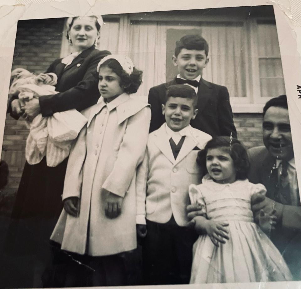 Evelyn and Oscar Alwan pose with their five children in front of their new home they built on N. Isabell Ave. in the 1950s.