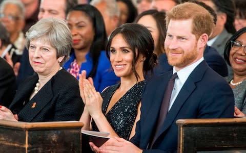 Prince Harry and Meghan Markle attend the memorial service  - Credit: DAVID PARKER/AFP/Getty Images