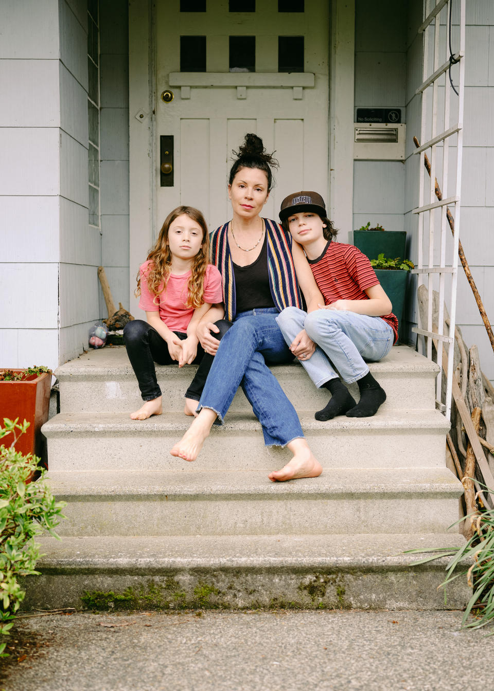 Amanda Carter Gomes, pictured with her two children outside their home. (Courtesy Elizabeth Rudge)