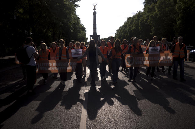 German police conduct raids on climate activists as impatience mounts