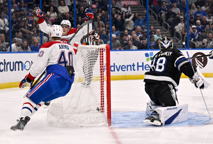 Montreal Canadiens right wing Joel Armia (40) scores on Tampa Bay Lightning goaltender Andrei Vasilevskiy (88) during the first period of an NHL hockey game Saturday, March 2, 2024, in Tampa, Fla. (AP Photo/Jason Behnken)