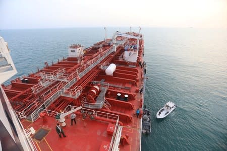 A boat of Iranian Revolutionary Guard is seen next to Stena Impero, a British-flagged vessel owned by Stena Bulk, at Bandar Abbas port