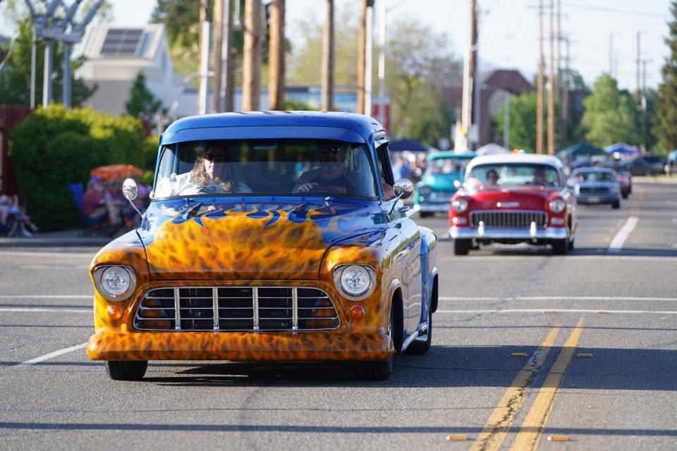 Classic cars parade along Churn Creek Road in Redding during the Kool April Nites Cruise on April 28, 2023.