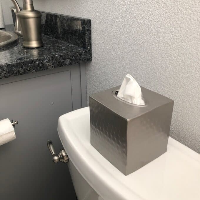 the silver tissue cover box in a reviewer's bathroom