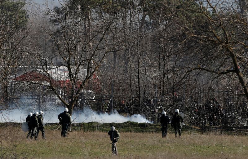 Greek riot police officers stand guard near Turkey's Pazarkule border crossing, in Kastanies