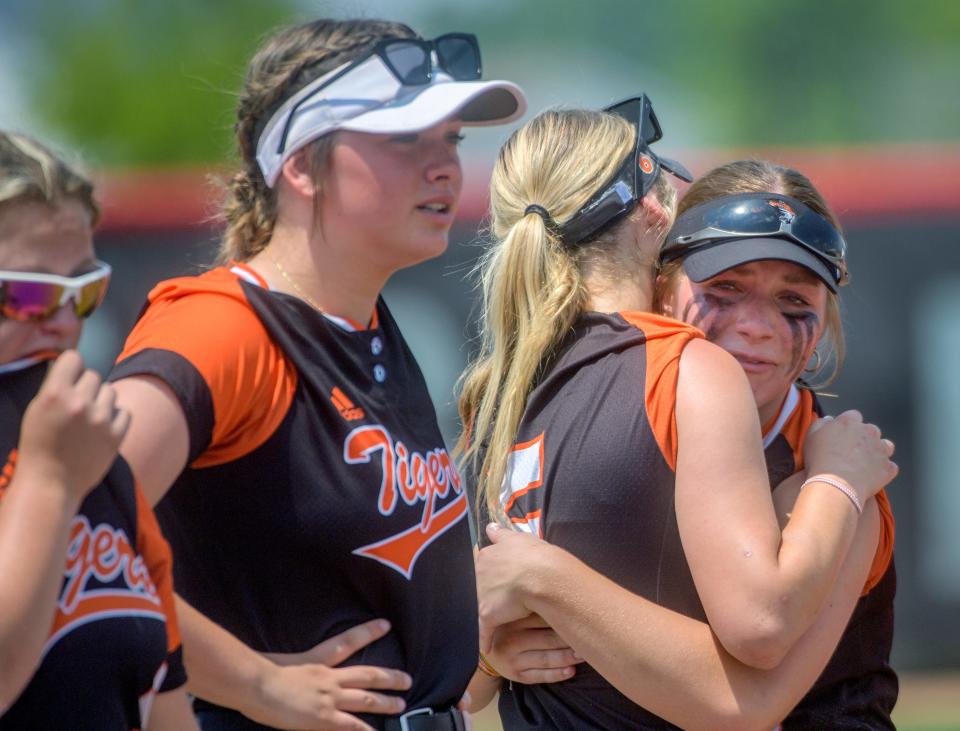 Illini Bluffs teammates Tessa Howard, right, and Lilly Hicks console each other after the Tigers' 7-6 loss to St. Bede in the Class 1A softball state title game Saturday, June 3, 2023 at the Louisville Slugger Sports Complex in Peoria.