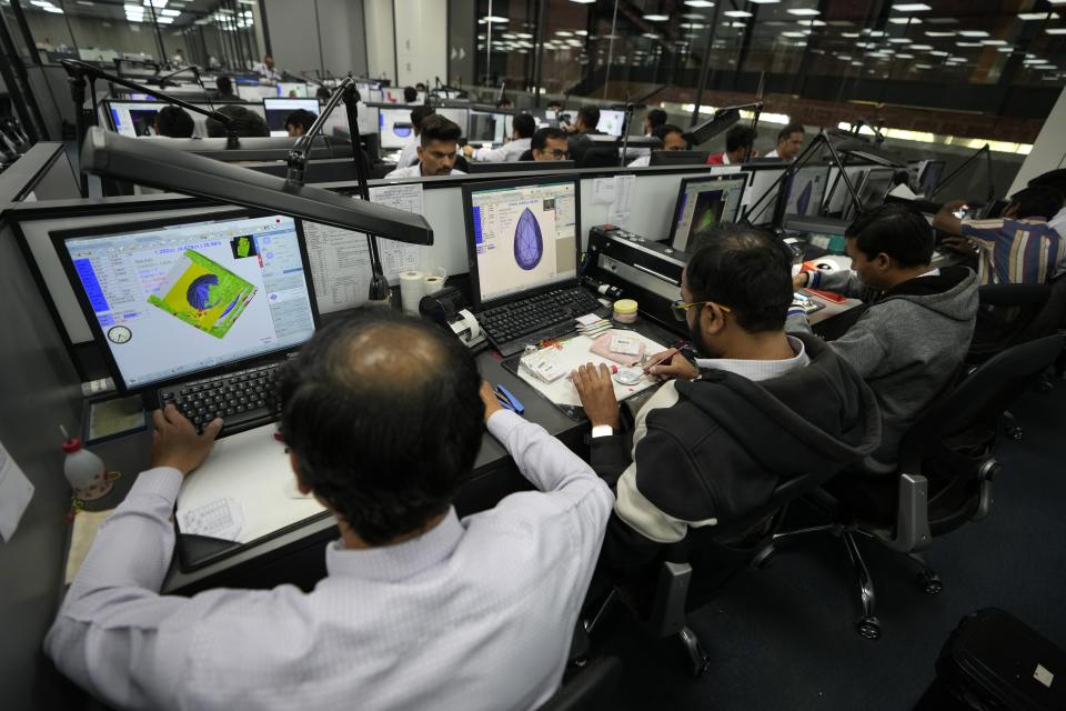 People work at a planning area of Greenlab Diamonds, a lab-grown diamond producer, in Surat, India, Monday, Feb. 5, 2024. (AP Photo/Ajit Solanki)