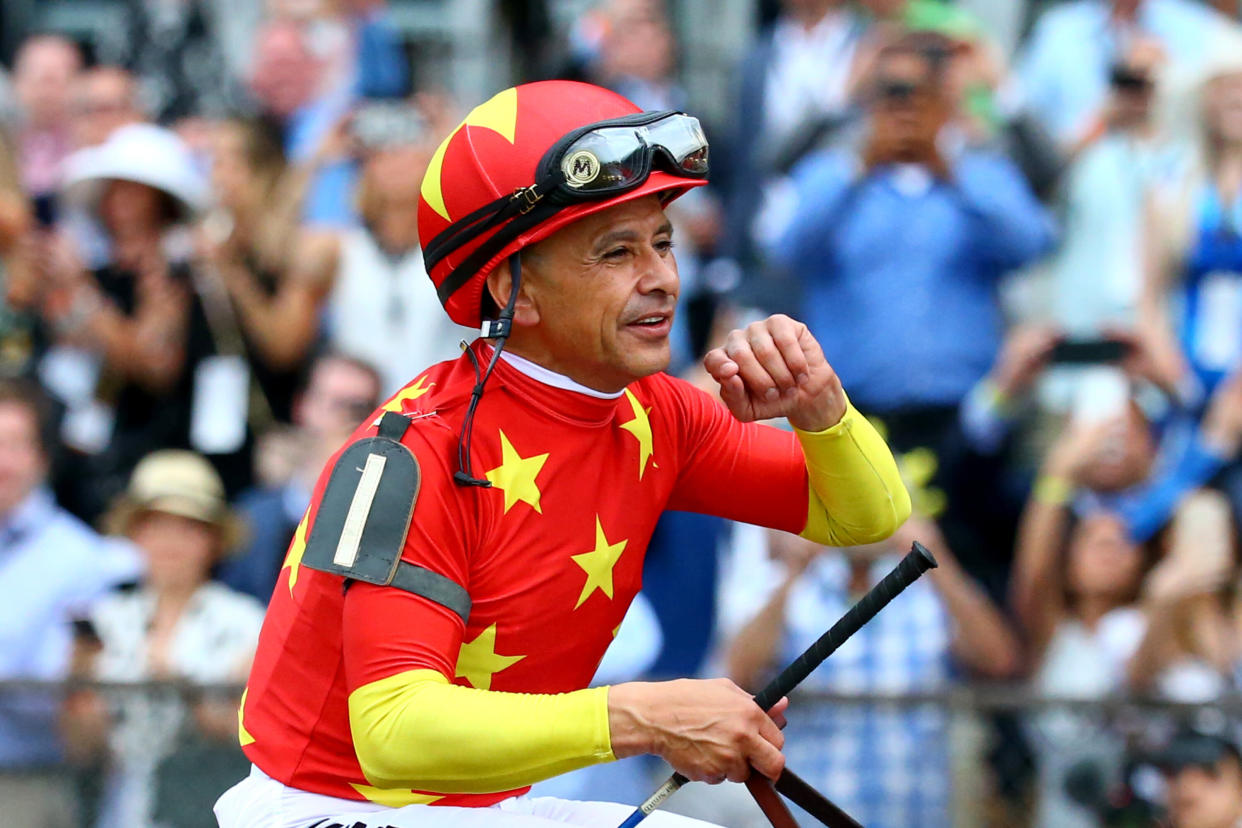 ELMONT, NY - JUNE 09:  Jockey Mike Smith celebrates atop of Justify #1 during the 150th running of the Belmont Stakes at Belmont Park on June 9, 2018 in Elmont, New York. Justify becomes the thirteenth Triple Crown winner and the first since American Pharoah in 2015.  (Photo by Mike Stobe/Getty Images)