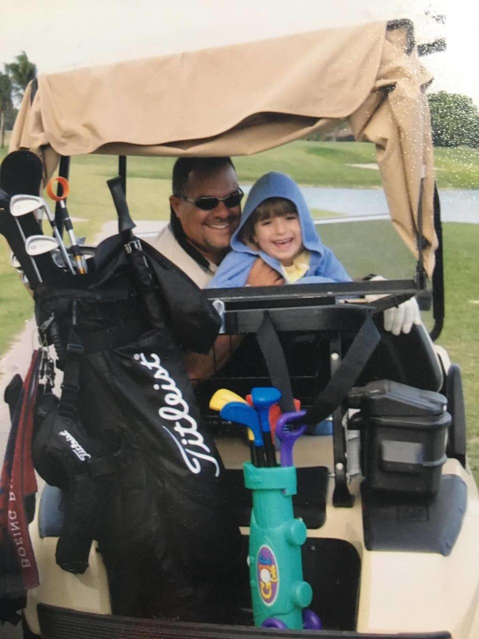George Moussa and daughter Megan in a 2003 photo when they played golf together on the Calusa Country Club course behind their house. The course closed in 2011.