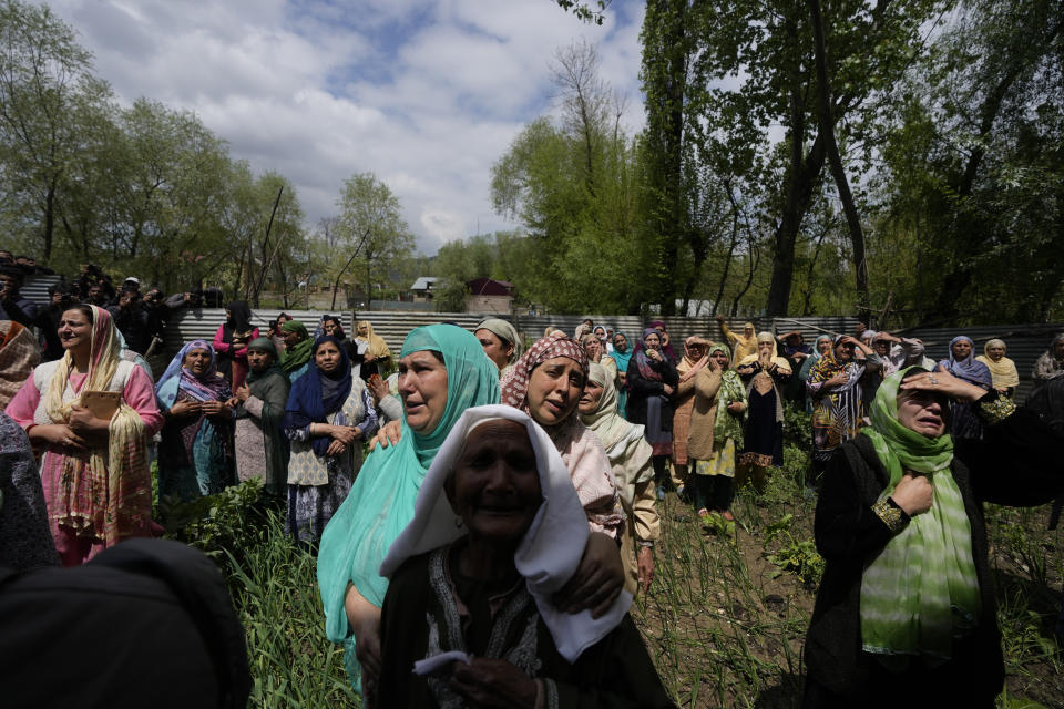 Women weep during a joint funeral of victims of a boat capsize on the outskirts of Srinagar, Indian controlled Kashmir, Tuesday, April. 16, 2024. The boat capsized in Jhelum river, most of the passengers were children, and rescuers were searching for many others who were still missing. (AP Photo/Mukhtar Khan)