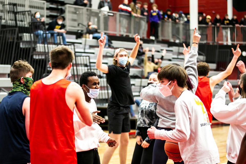 Members of the Community Inclusion Club cheer during in a basketball game, Thursday, Feb. 3, 2022, at City High School in Iowa City, Iowa.