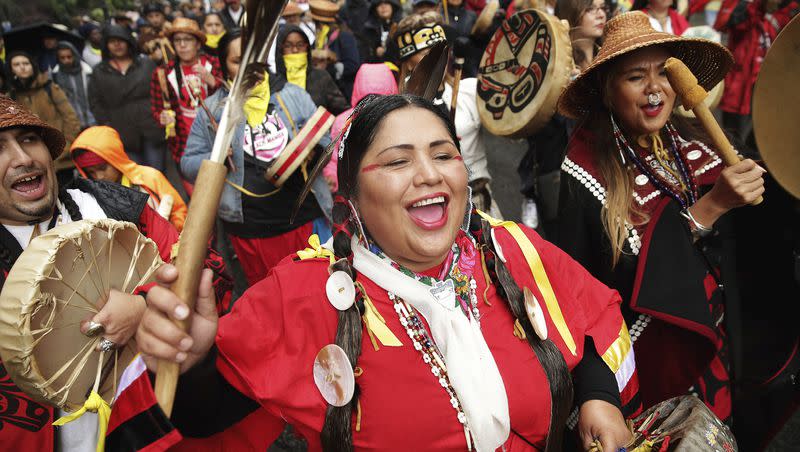 Roxanne White, of Yakima Nation, sings as a group marches from Westlake Park to City Hall to mark the annual Indigenous People’s Day Celebration on Monday, Oct. 8, 2018.