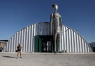 People visit the Alien Research Center in Hiko, as an influx of tourists responding to a call to 'storm' Area 51, is expected in Rachel, Nevada