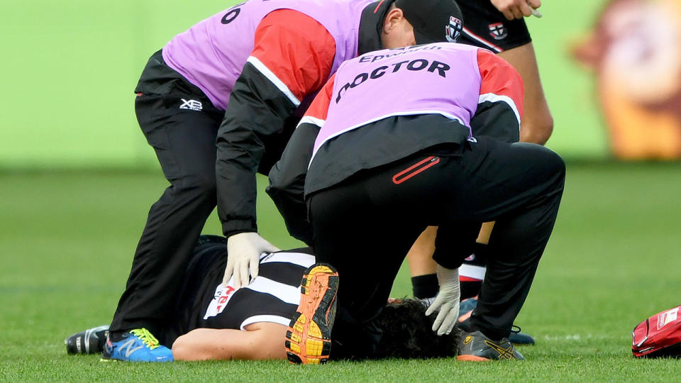 Pictured here, medical staff attend to Dylan Roberton after he collapsed in a 2018 AFL match.