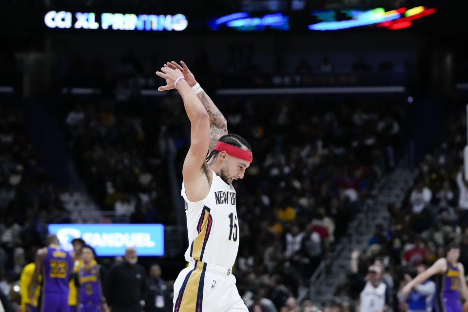 New Orleans Pelicans guard Jose Alvarado (15) encourages the crowd during a scoring run in the second half of an NBA basketball game against the Los Angeles Lakers in New Orleans, Sunday, Dec. 31, 2023. The Pelicans won 129-109. (AP Photo/Gerald Herbert)