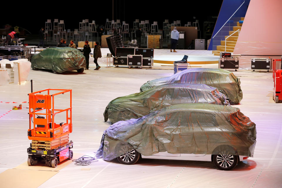 Covered cars are pictured at the Palexpo exhibition centre as the 90th edition of the International Motor Show is cancelled to curb the spread of the coronavirus, in Geneva, Switzerland, February 28, 2020. REUTERS/Pierre Albouy