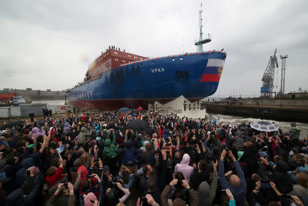 People attend the float out ceremony of the nuclear-powered icebreaker "Ural" at the Baltic Shipyard in St. Petersburg, Russia May 25, 2019. REUTERS/Anton Vaganov