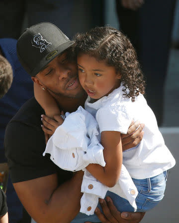 REFILE -- CORRECTING TYPO -- A student who was evacuated after a shooting at North Park Elementary School is embraced after groups of them were reunited with parents waiting at a high school in San Bernardino, California, U.S. April 10, 2017. REUTERS/Mario Anzuoni