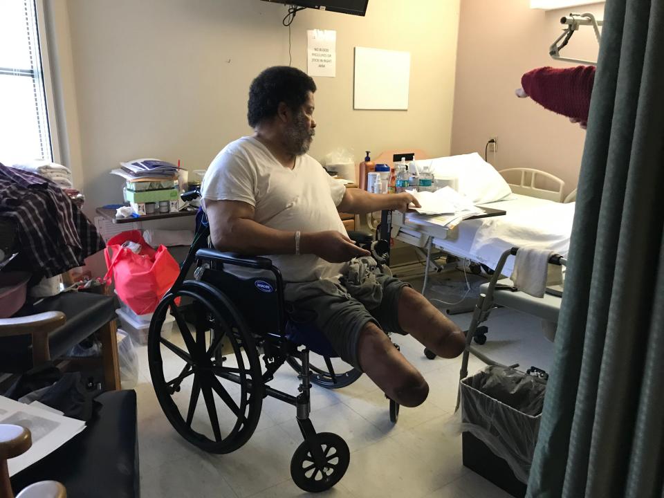 Jerry Holliman, 69, reviews medical paperwork on Jan. 2, 2019, in his room at the Veterans Home in Collins, Mississippi.