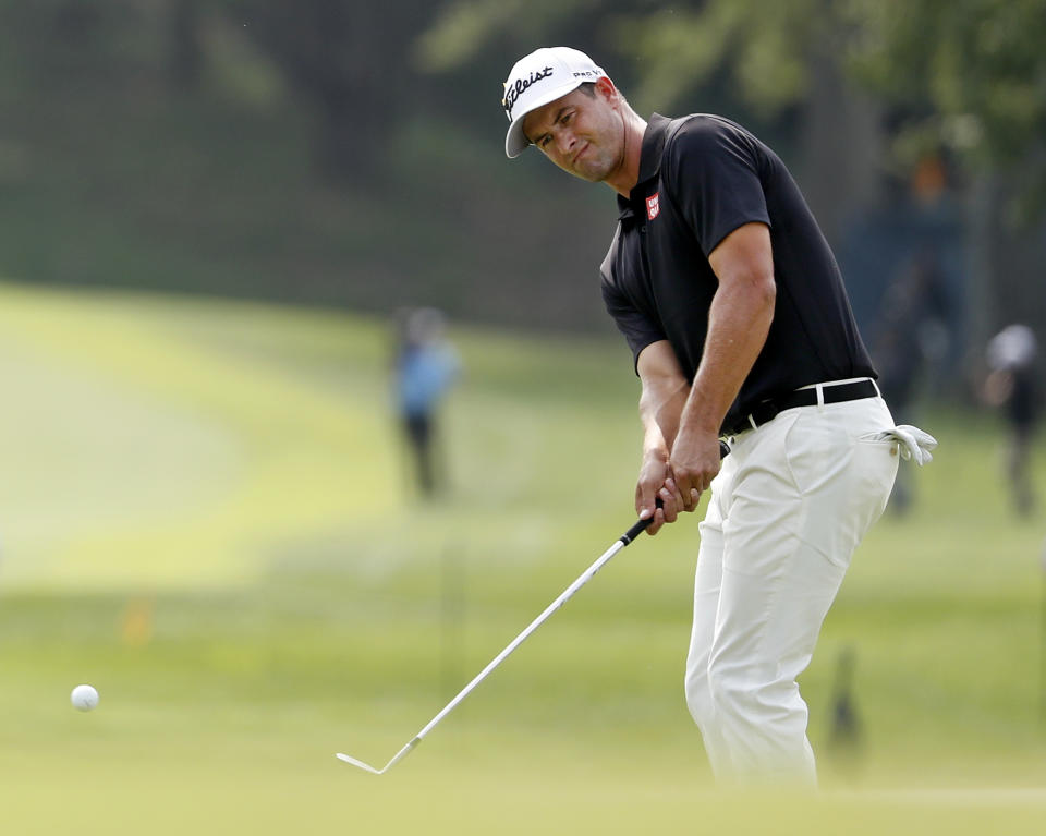 Adam Scott, of Australia, chips onto eighth green during the final round of the PGA Championship golf tournament at Bellerive Country Club, Sunday, Aug. 12, 2018, in St. Louis. (AP Photo/Jeff Roberson)