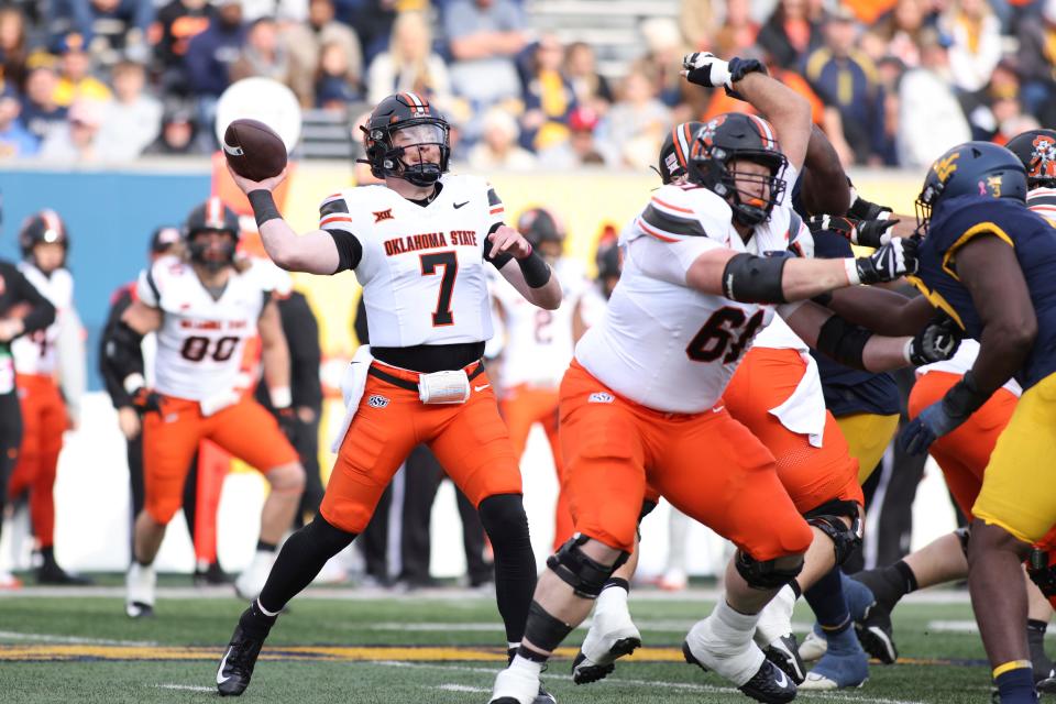 Oklahoma State quarterback Alan Bowman throws a pass during the first half against West Virginia on Saturday in Morgantown, W.Va.