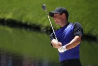 Rory McIlroy of Northern Ireland watches his shot in the 16th hole during Tuesday practice rounds for the 2017 Masters at Augusta National Golf Club in Augusta, Georgia, U.S., April 4, 2017. REUTERS/Brian Snyder