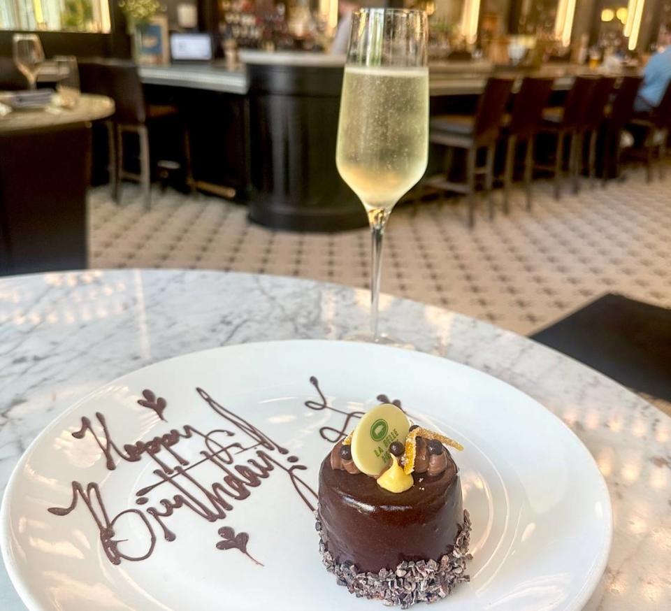 A complimentary birthday dessert with a glass of champagne at La Belle Helene.