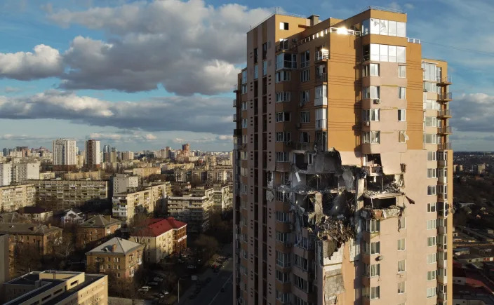 This general view shows damage to the upper floors of a building in Kyiv on February 26, 2022, after it was reportedly struck by a Russian rocket.