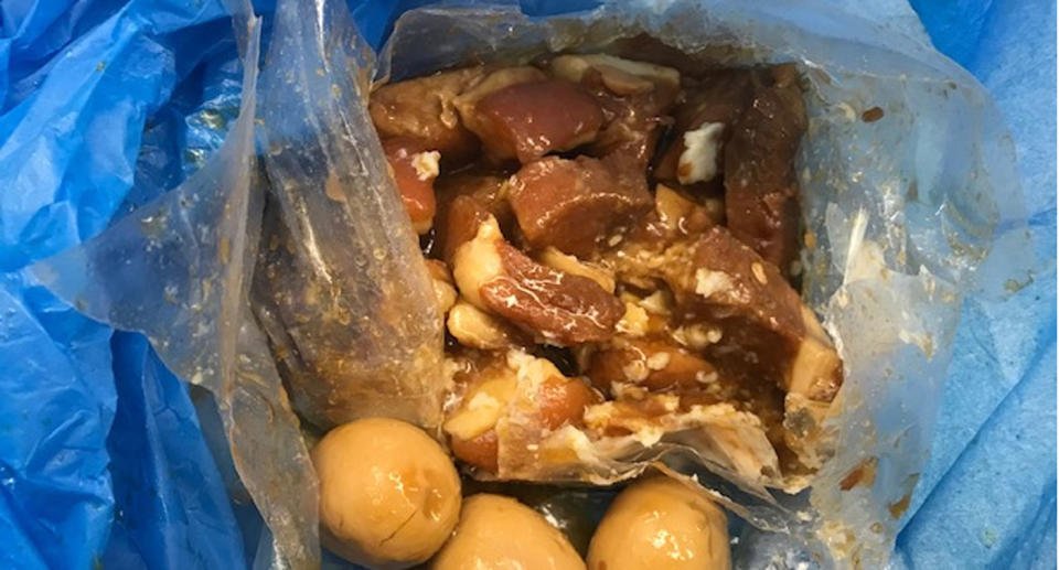 A plastic bag containing uncooked pork and eggs seized by Australian Border Force.