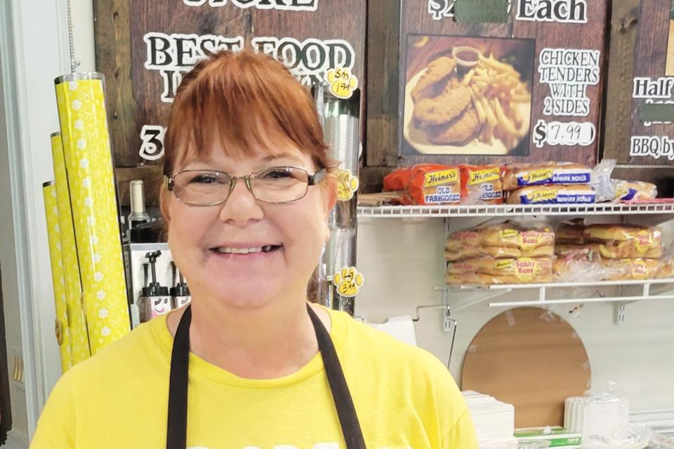 Debra Orcutt is a baker at Four Seasons Country Store in Logan, West Virginia, specializing in a peanut butter fudge. Orcutt says she has managed depression for many years after the loss of her young son from a congenital illness. (Phil Galewitz/KFF Health News)