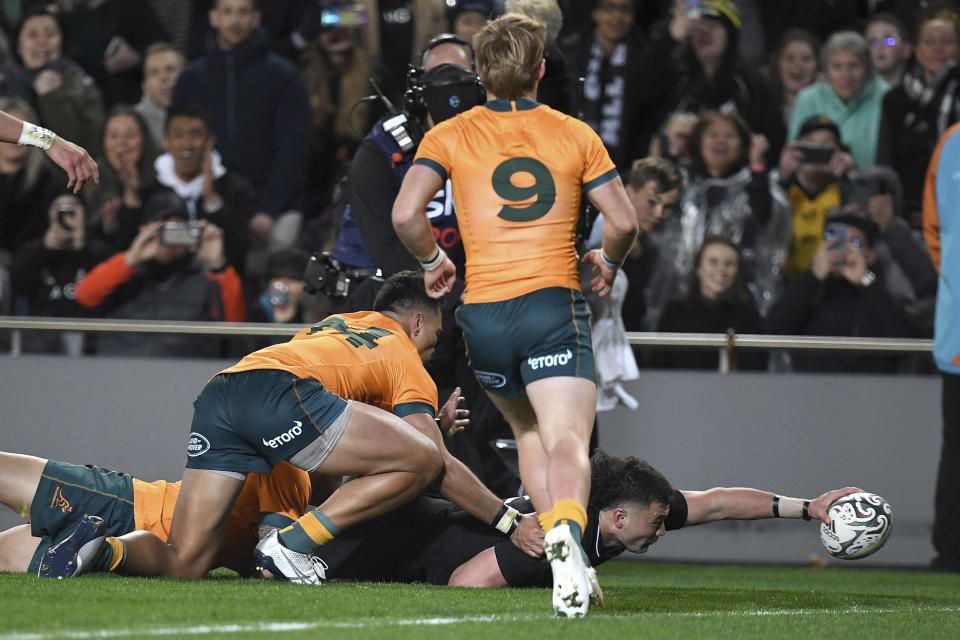 New Zealand's David Havili, right, score a try as Australia's Jordan Petaia fails to stop him during their Bledisloe Cup rugby union test match at Eden Park in Auckland, New Zealand, Saturday, Aug. 7, 2021. (Jeremy Ward/Photosport via AP)